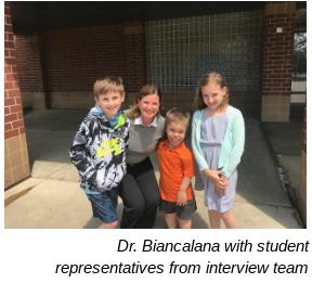 Dr. Biancalana with student representatives from interview team